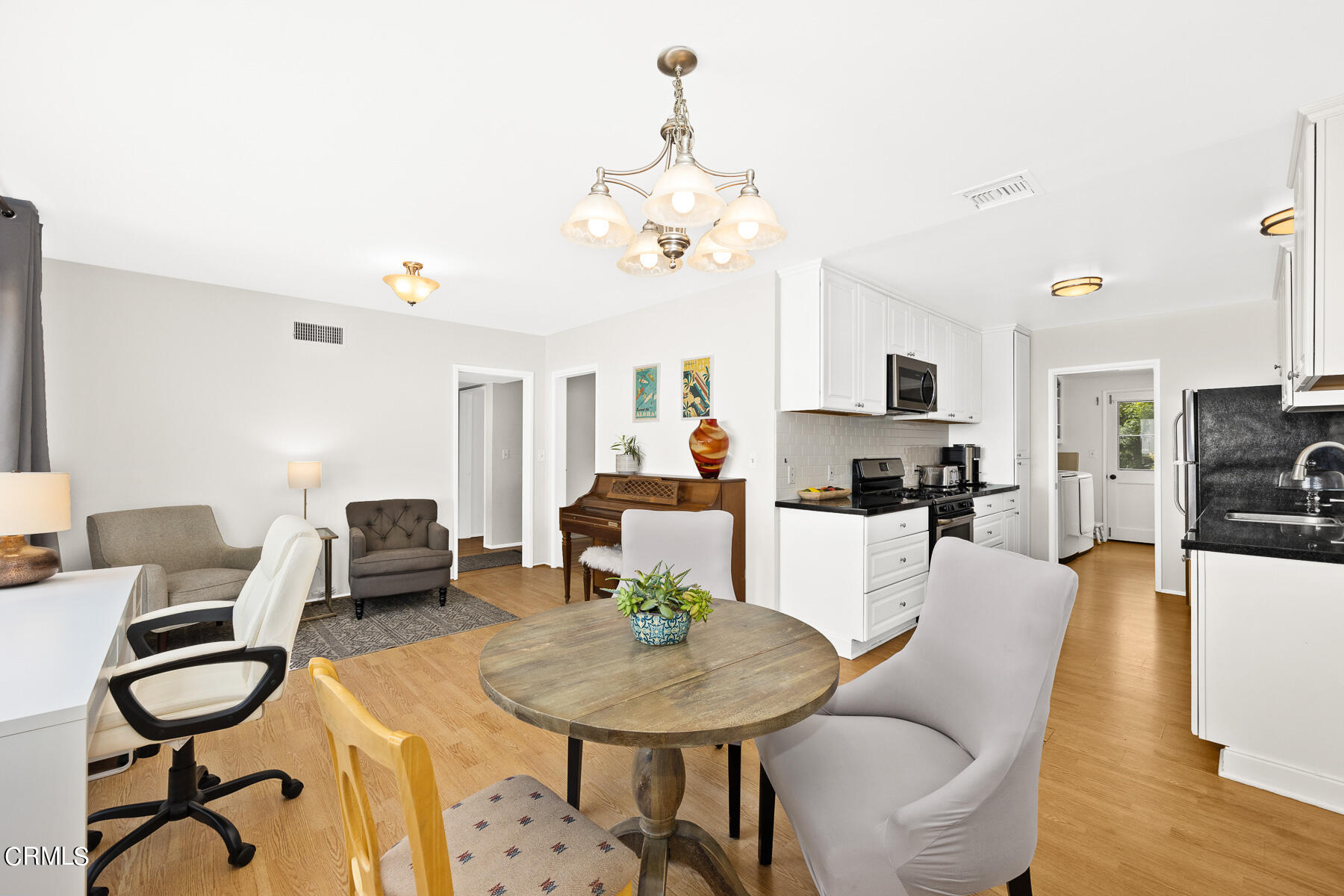 636 Knight Way La Canada Flintridge, CA 91011 - Photo 11 of 44 a living room with furniture a dining table and chairs with wooden floor
