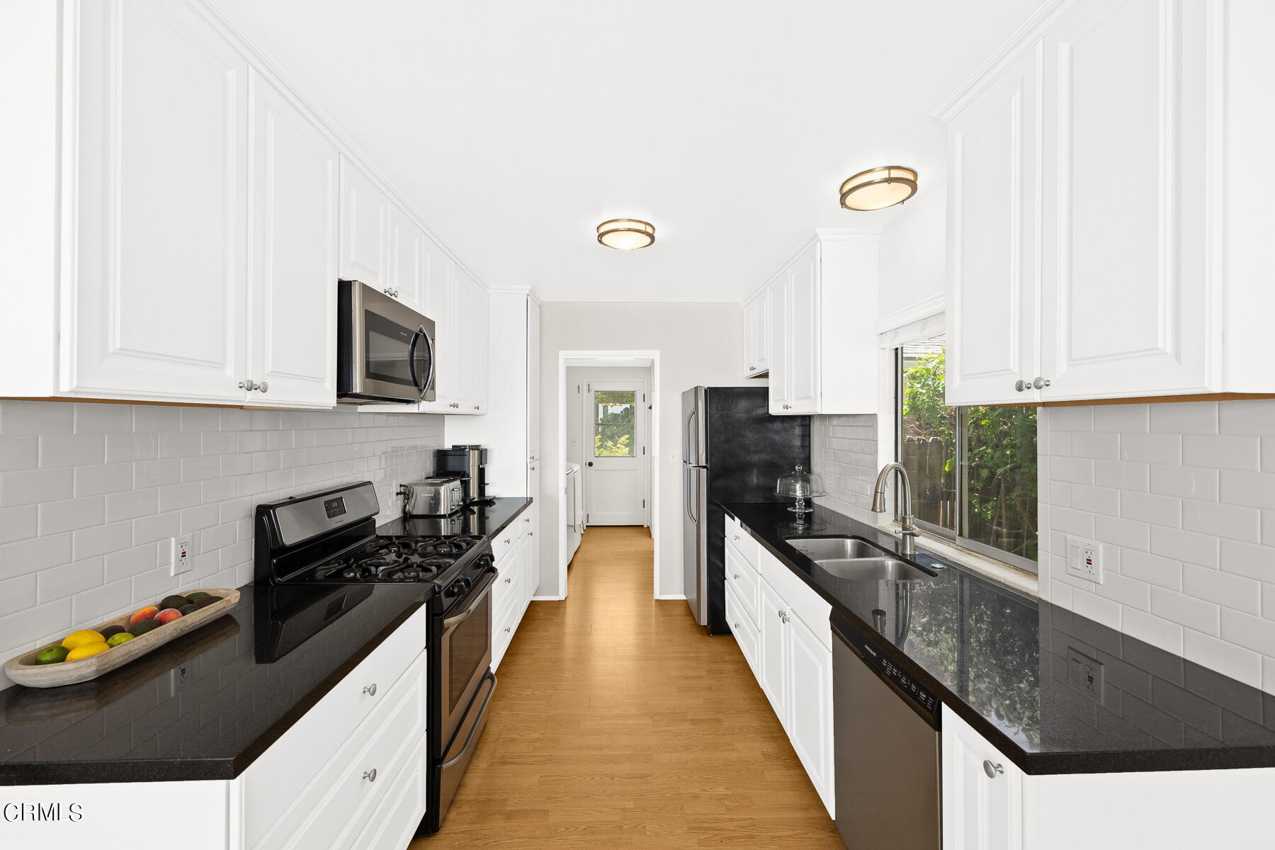 636 Knight Way La Canada Flintridge, CA 91011 - Photo 14 of 44 a kitchen with stainless steel appliances a stove top oven a sink a counter space and cabinets