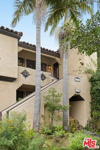 a view of a terrace with a tree