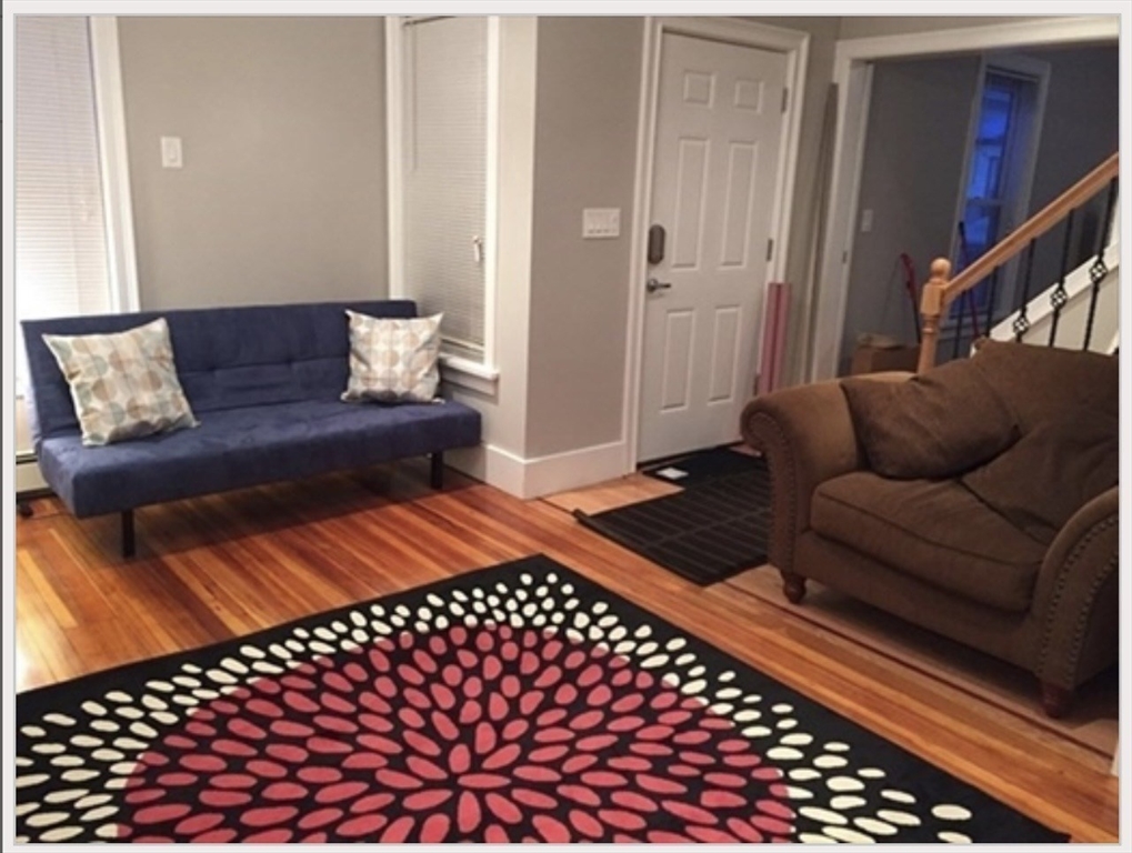 18 West Street, Unit A Everett, MA 02149 - Photo 5 of 10 a living room with furniture and a rug
