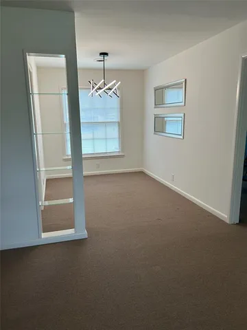 an empty room with a mirror