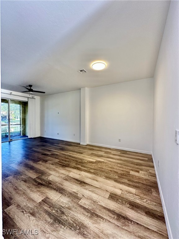 10210 Tin Maple Drive, Unit 135 Estero, FL 33928 - Photo 6 of 19 a view of empty room with wooden floor
