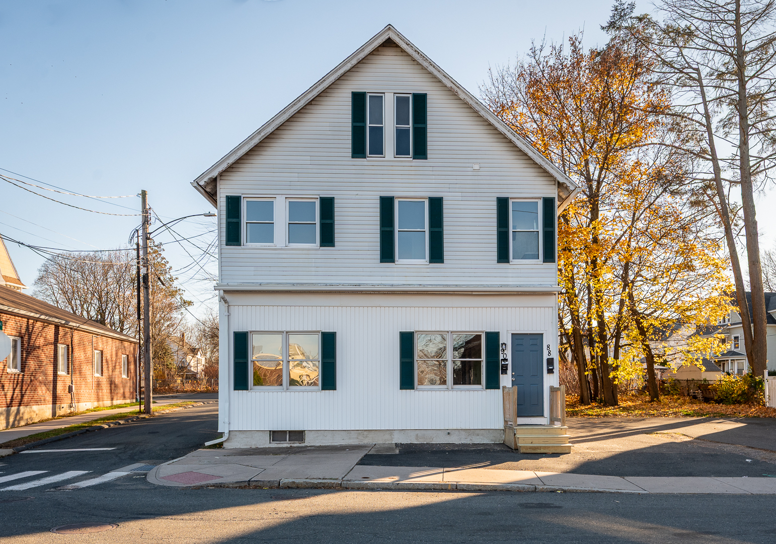 a front view of a house with a yard