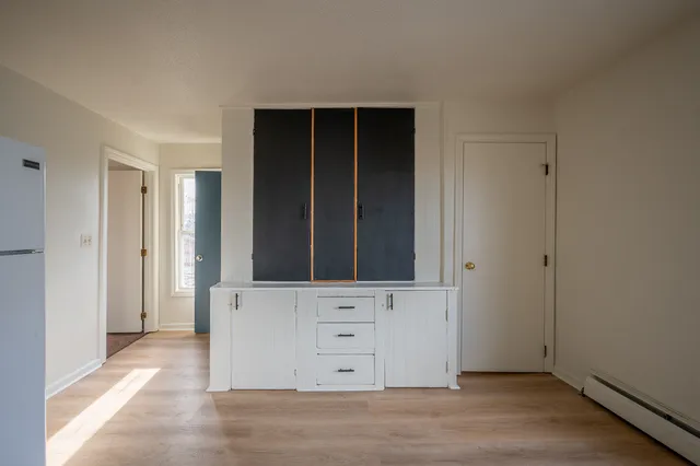 a view of an entryway with wooden floor
