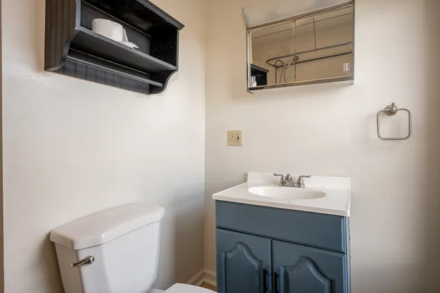 a bathroom with a sink and mirror