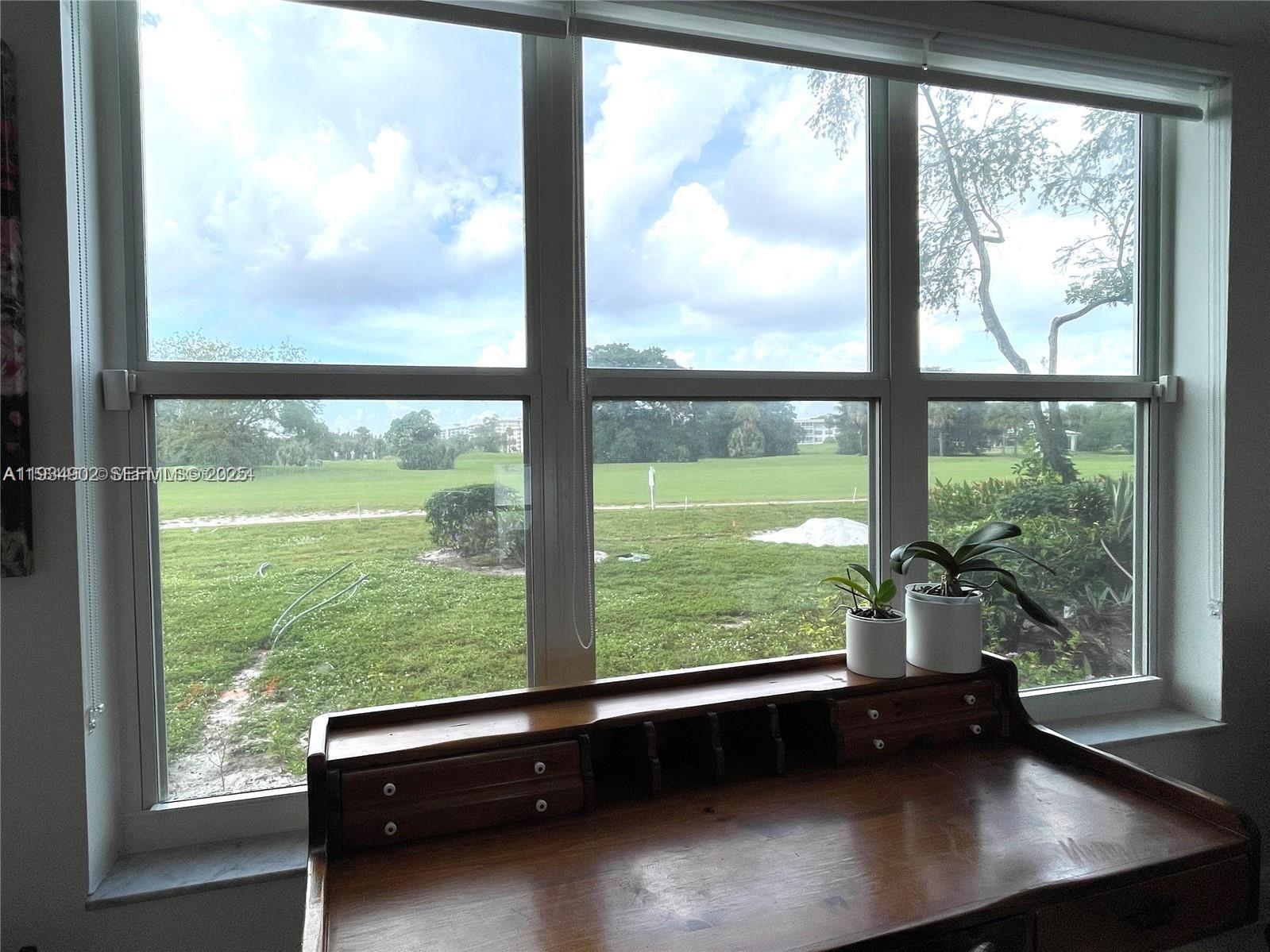 2671 South Course Drive, Unit 109 Pompano Beach, FL 33069 - Photo 24 of 39 a view of a room with window