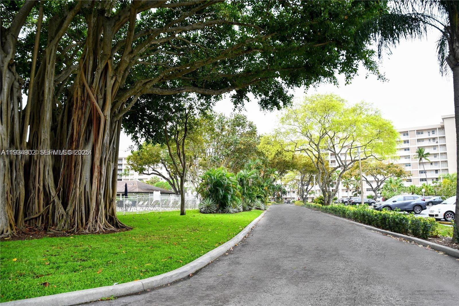 2671 South Course Drive, Unit 109 Pompano Beach, FL 33069 - Photo 39 of 39 a view of a garden