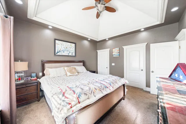 a bathroom with a double vanity sink mirror and toilet