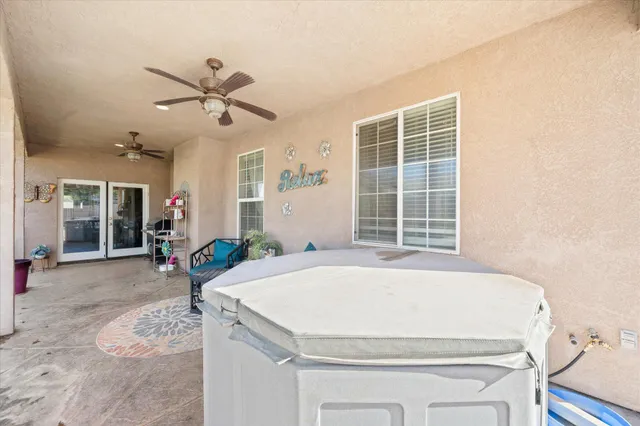 a view of a room with furniture and a window