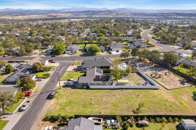 an aerial view of residential house with outdoor space