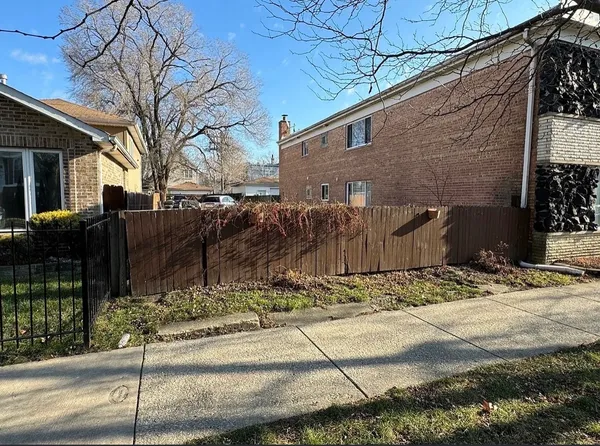 a view of a house with a street