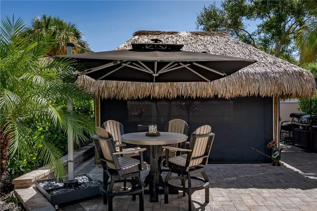 a patio with table and chairs