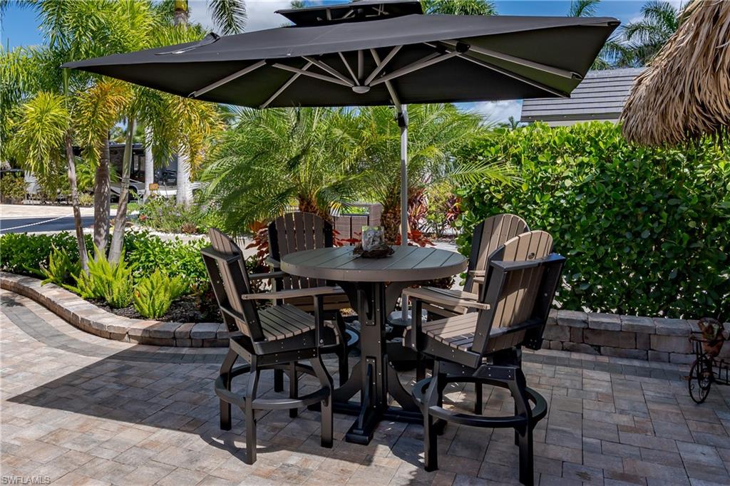 13571 Snook Circle Naples, FL 34114 - Photo 15 of 47 a view of an outdoor sitting area with furniture and backyard