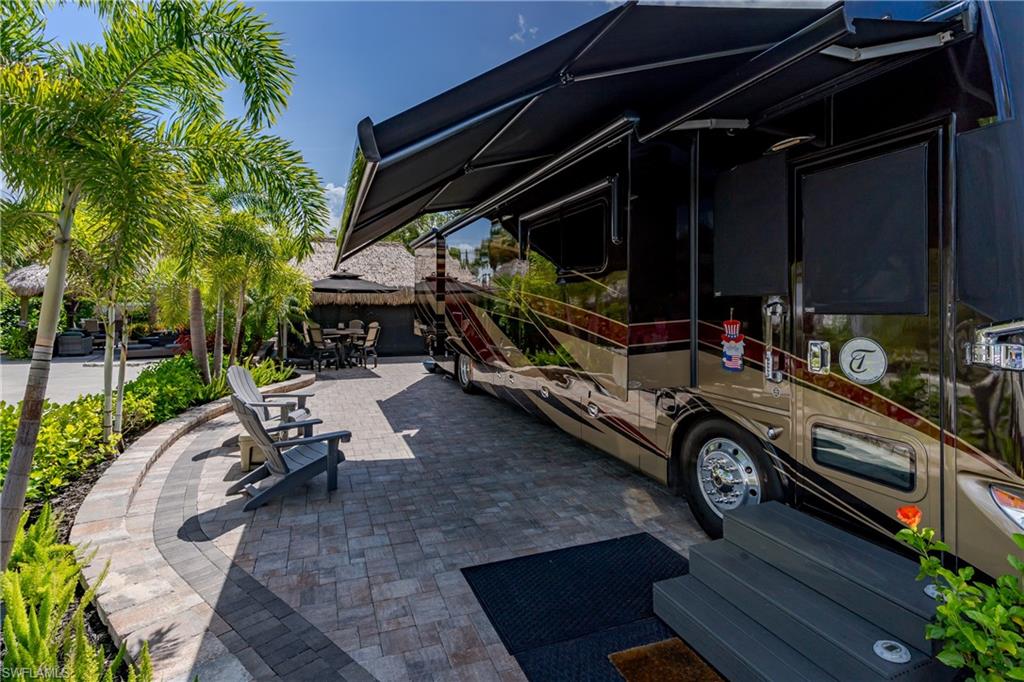 13571 Snook Circle Naples, FL 34114 - Photo 17 of 47 a car parked in front of a house