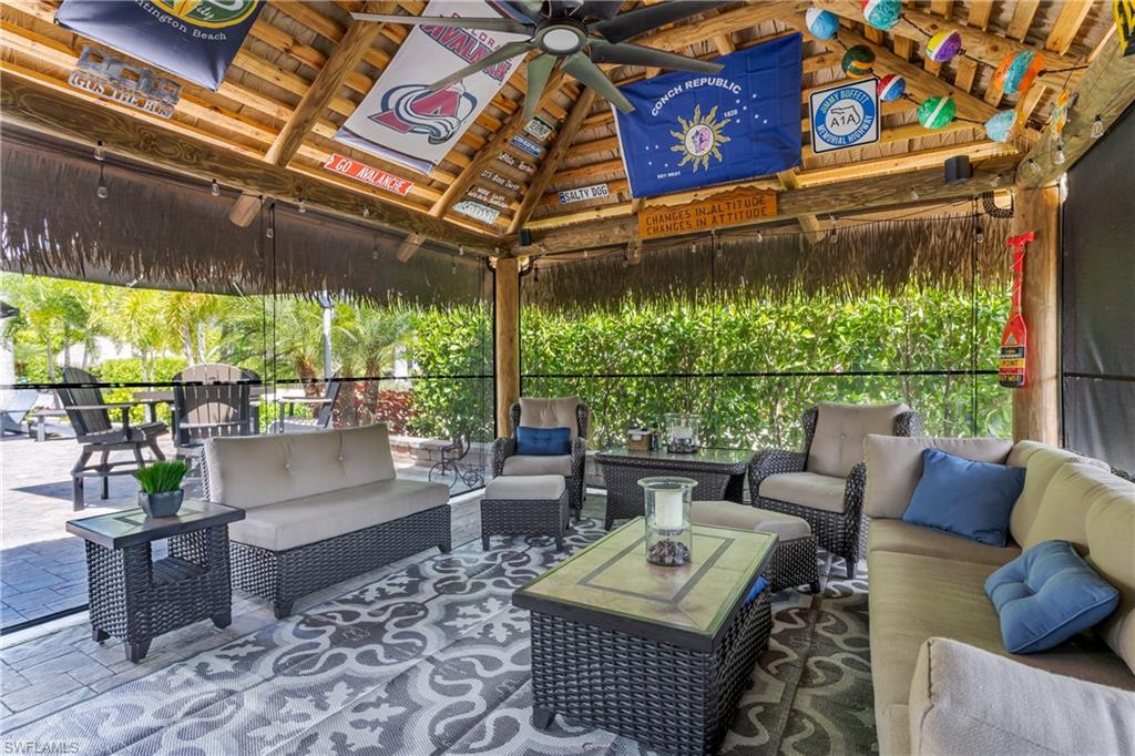 13571 Snook Circle Naples, FL 34114 - Photo 3 of 47 a outdoor living space with furniture and garden view