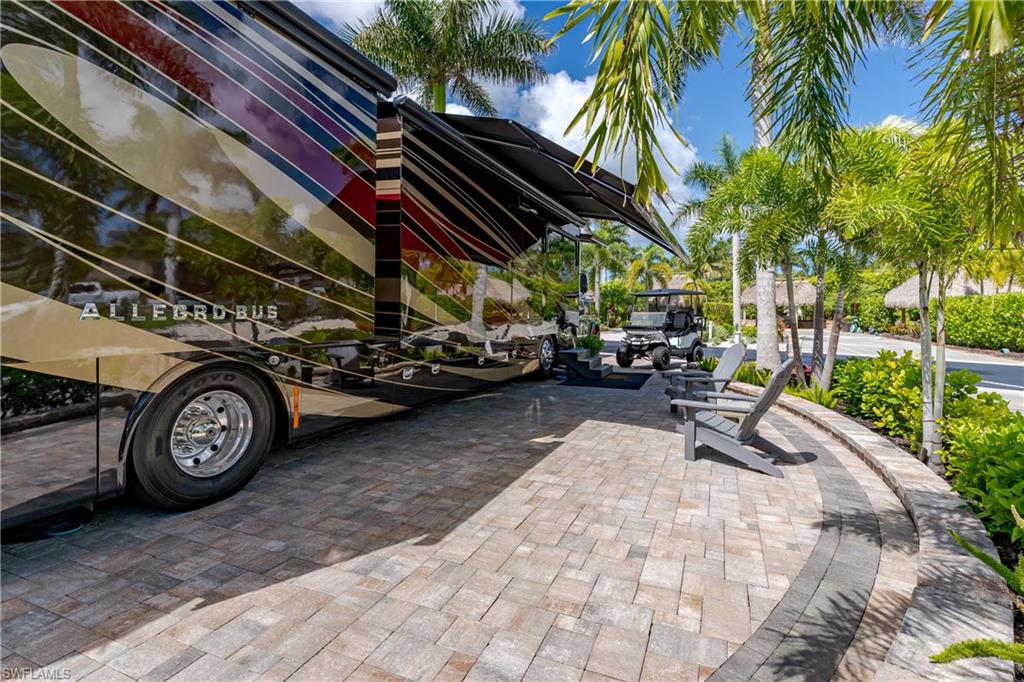 13571 Snook Circle Naples, FL 34114 - Photo 32 of 47 a view of a two chairs in a patio
