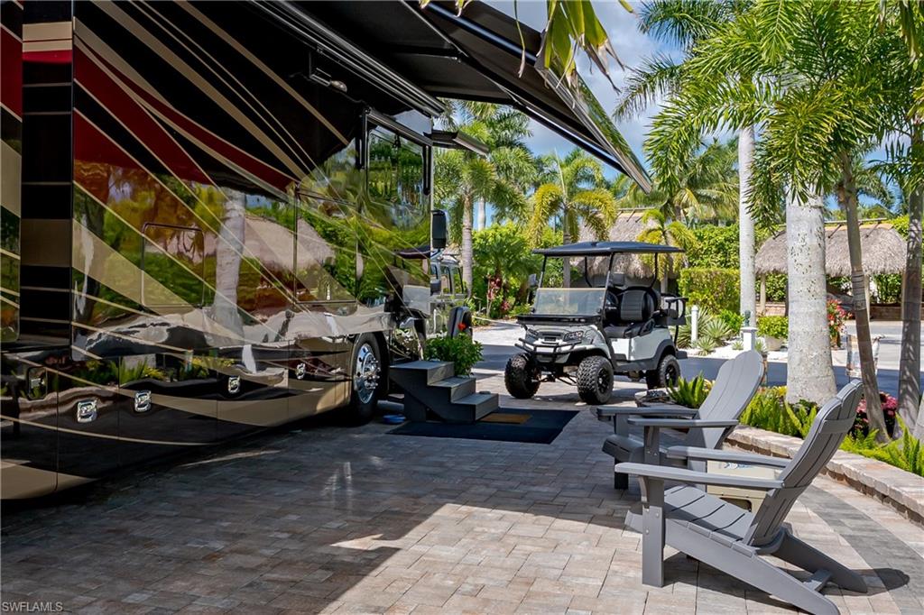 13571 Snook Circle Naples, FL 34114 - Photo 34 of 47 a view of a chairs and table in the patio