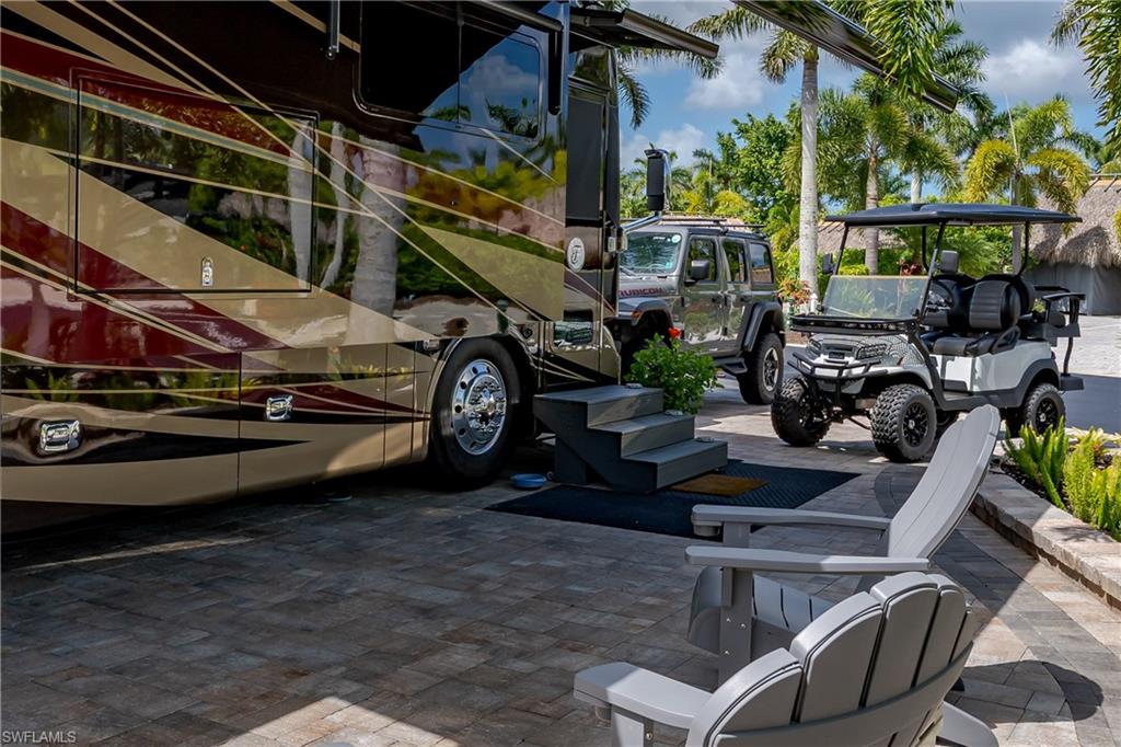 13571 Snook Circle Naples, FL 34114 - Photo 35 of 47 a car parked in front of a house
