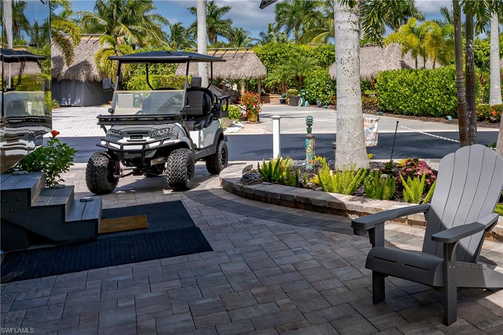 13571 Snook Circle Naples, FL 34114 - Photo 36 of 47 a view of a backyard with sitting area