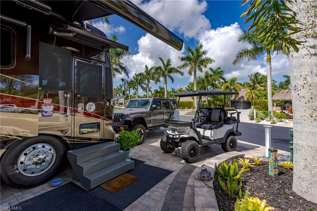 13571 Snook Circle Naples, FL 34114 - Photo 38 of 47 a view of a chairs and tables in a patio