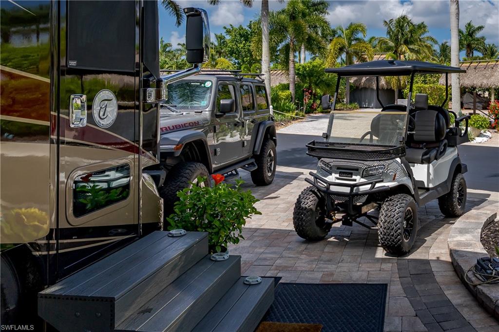 13571 Snook Circle Naples, FL 34114 - Photo 40 of 47 a view of a chairs and table in the patio