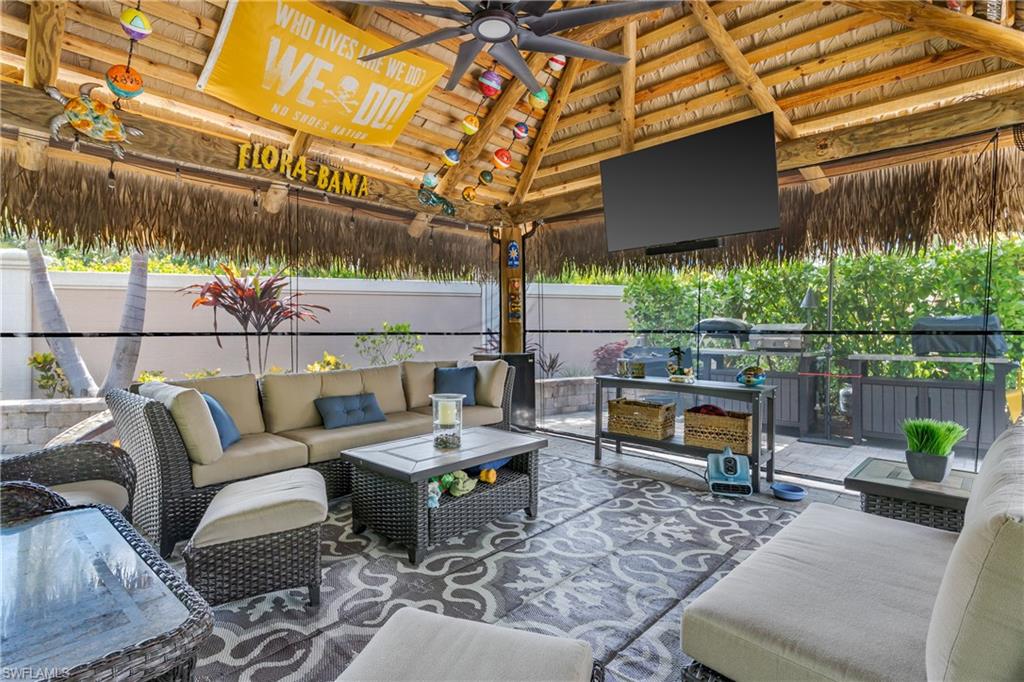 13571 Snook Circle Naples, FL 34114 - Photo 4 of 47 a backyard of a house with outdoor seating