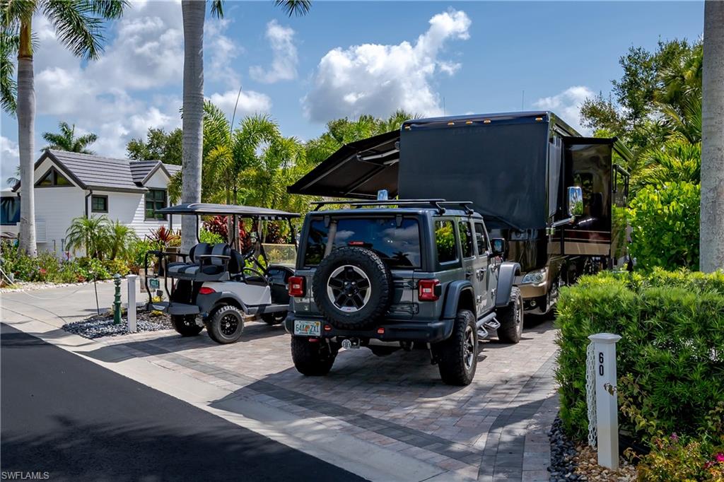 13571 Snook Circle Naples, FL 34114 - Photo 43 of 47 a car parked in front of a house