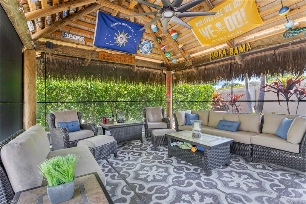 13571 Snook Circle Naples, FL 34114 - Photo 5 of 47 a outdoor living space with furniture and garden view