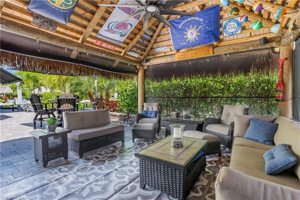 13571 Snook Circle Naples, FL 34114 - Photo 6 of 47 a outdoor living space with furniture and garden view