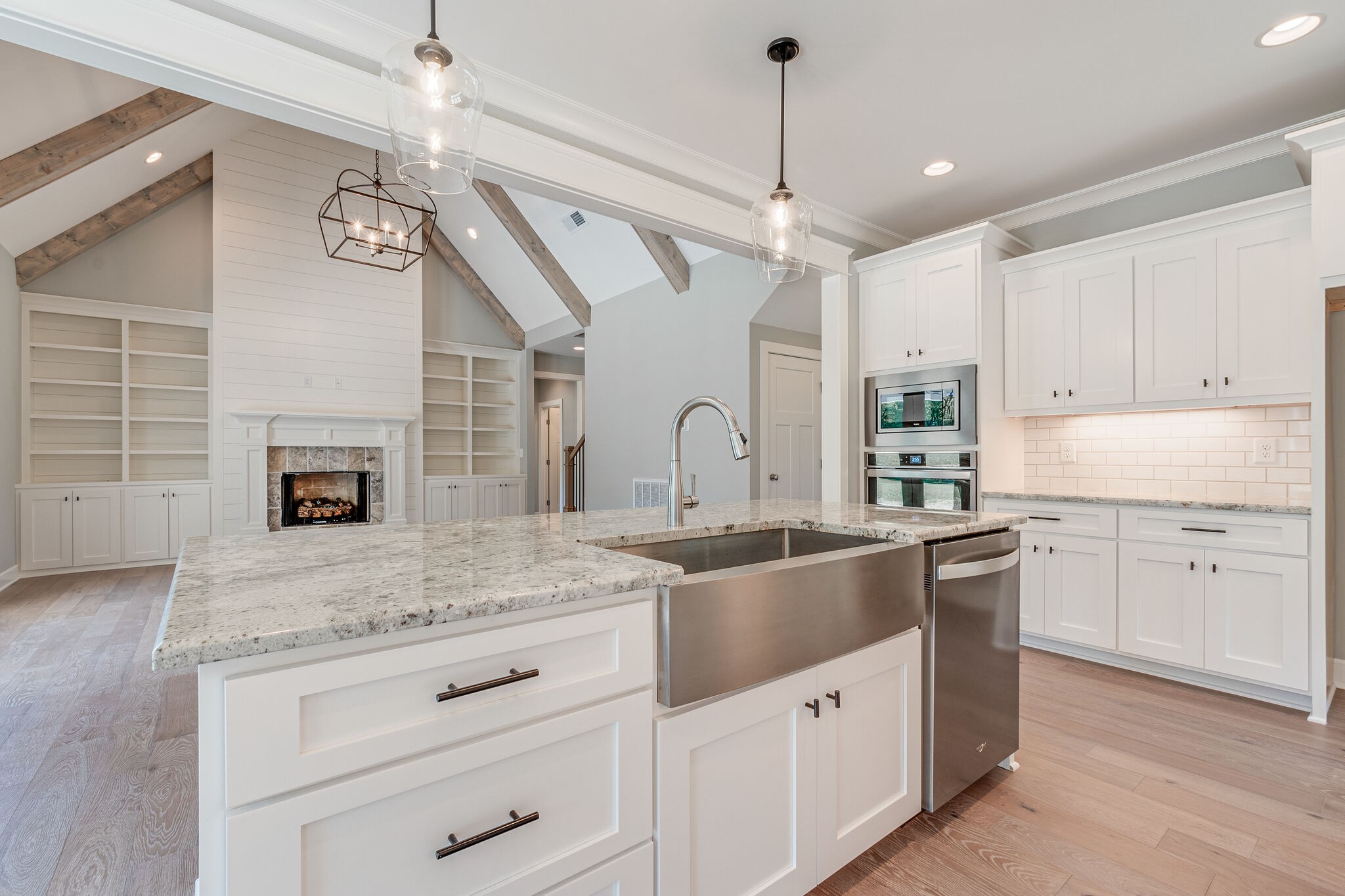 12425 North Milton Road Milton, TN 37118 - Photo 14 of 34 a kitchen with granite countertop a sink stainless steel appliances and chandelier
