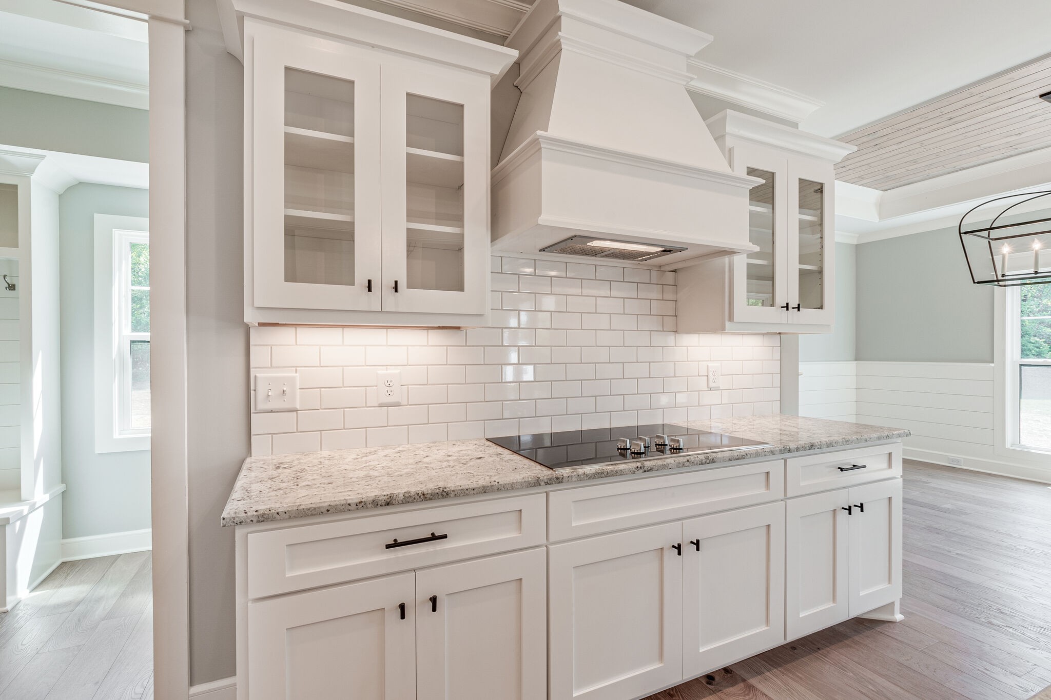 12425 North Milton Road Milton, TN 37118 - Photo 15 of 34 a kitchen with granite countertop white cabinets and white appliances