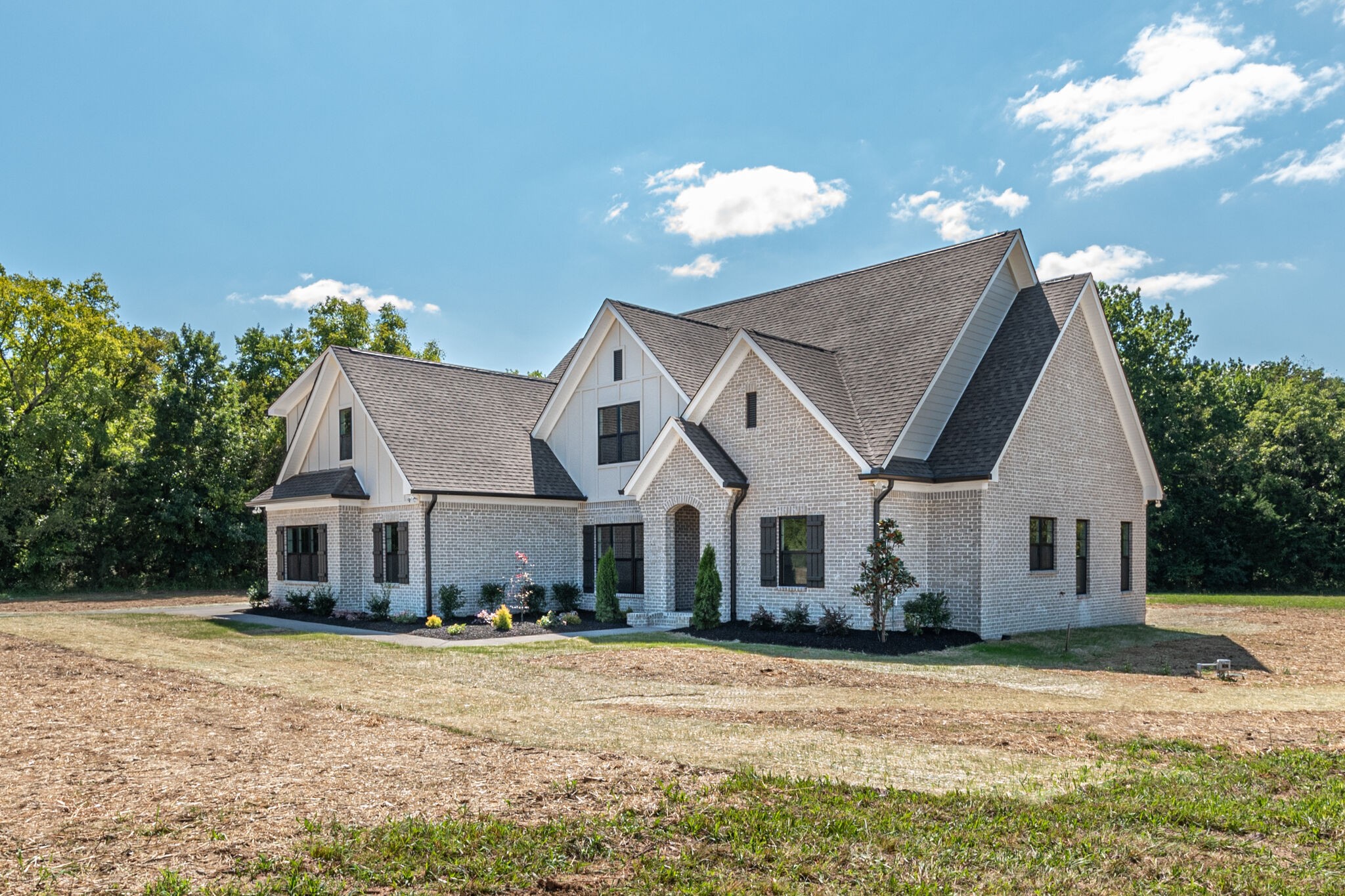 12425 North Milton Road Milton, TN 37118 - Photo 3 of 34 a front view of a house with a yard