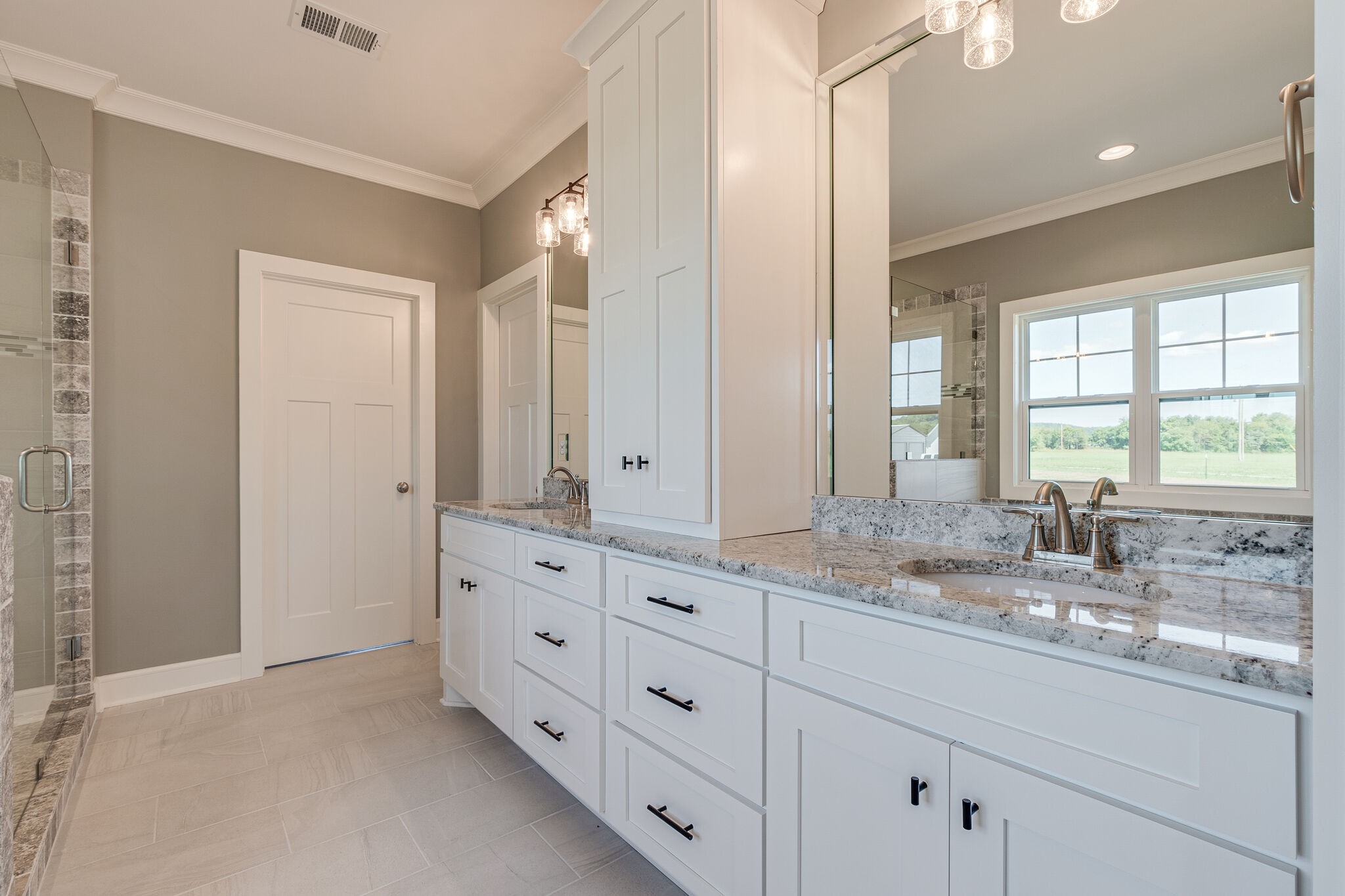 12425 North Milton Road Milton, TN 37118 - Photo 24 of 34 a bathroom with double vanity sink a mirror and a bathtub