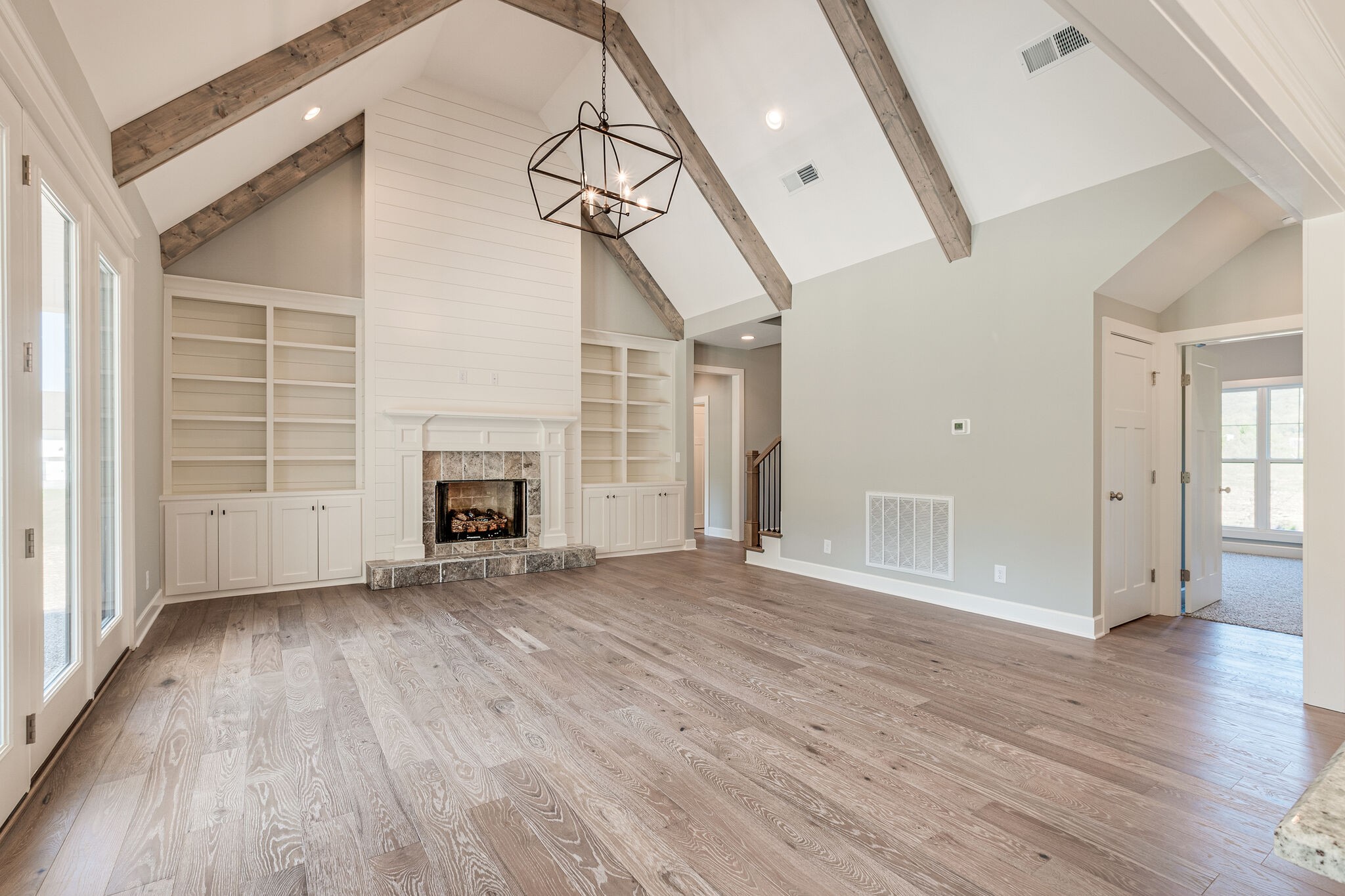 12425 North Milton Road Milton, TN 37118 - Photo 7 of 34 a view of an empty room with wooden floor fireplace and a window