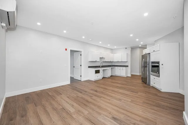 a view of kitchen with wooden floor