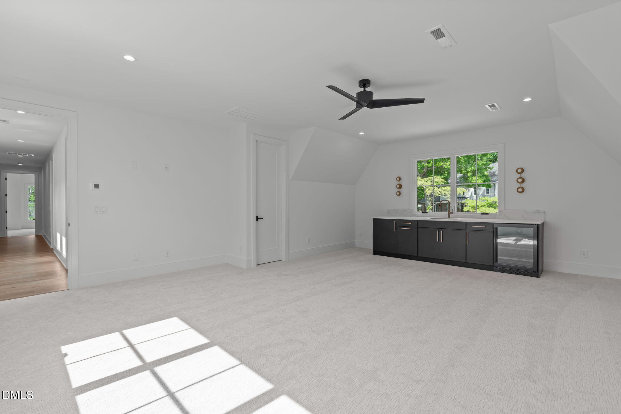 7917 South Bridgewater Court Raleigh, NC 27615 - Photo 51 of 67 an empty room with windows and ceiling fan