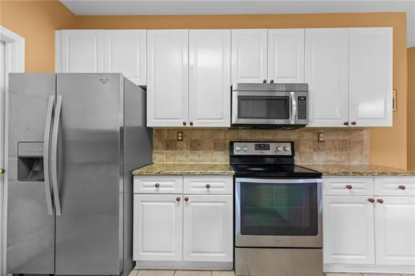 a kitchen with sink and window