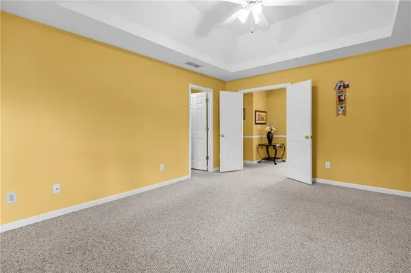 a view of empty room with fan