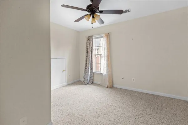 a view of empty room with windows