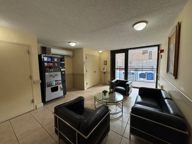 a view of a building with sitting area