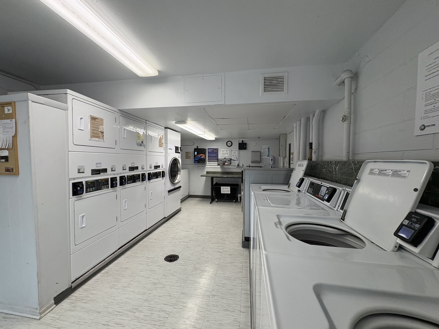 21 West Goethe Street, Unit 2A Chicago, IL 60610 - Photo 35 of 49 a kitchen with refrigerator and white cabinets