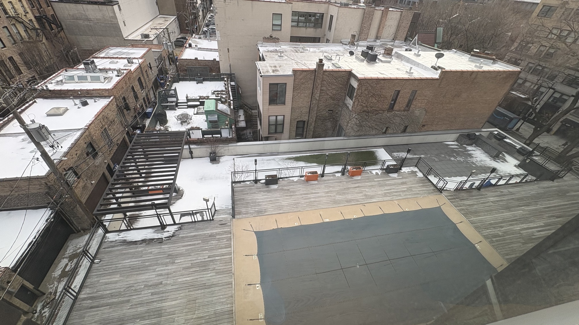 21 West Goethe Street, Unit 2A Chicago, IL 60610 - Photo 40 of 49 a view of a rooftop deck with couch and chairs