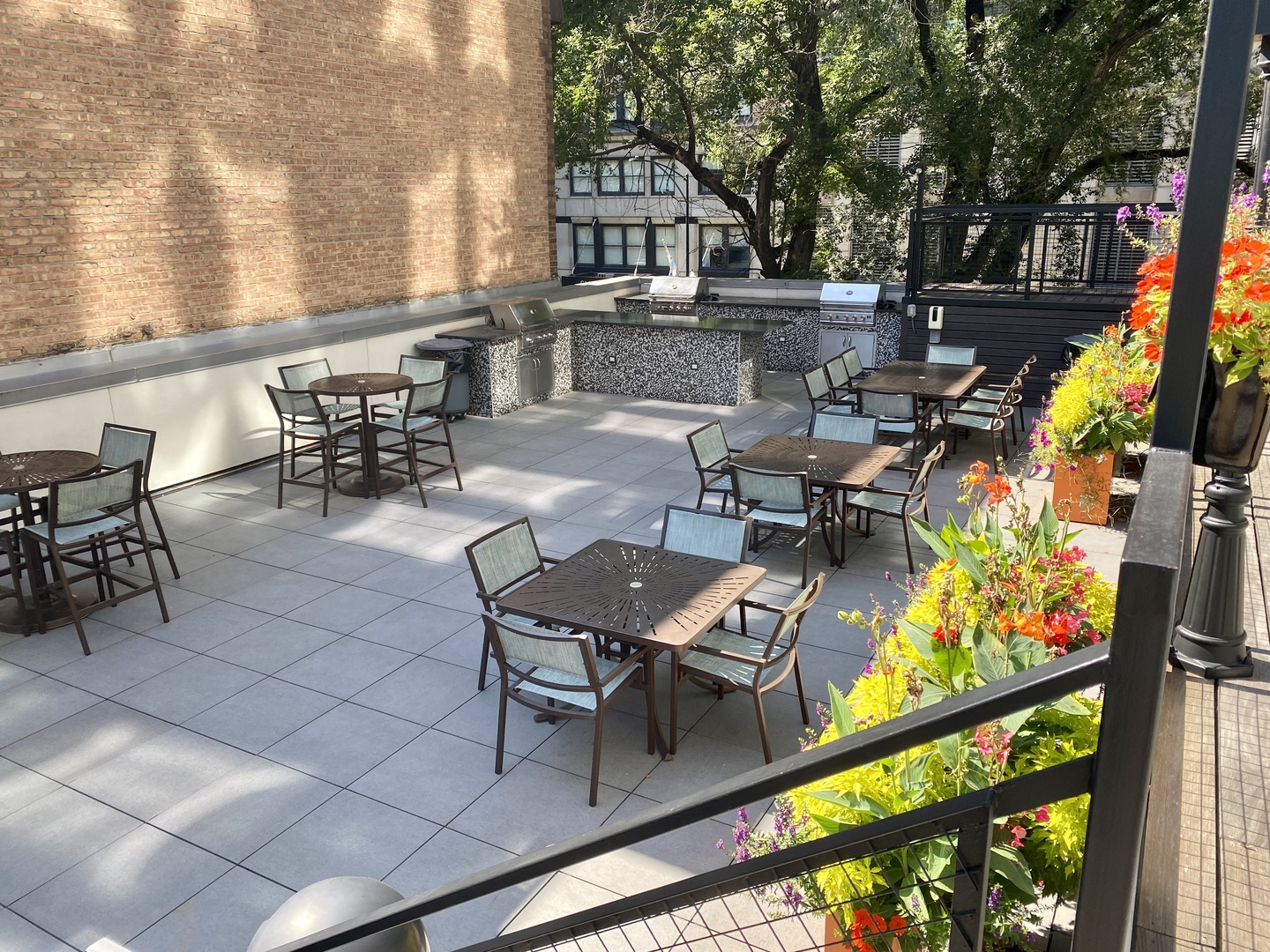 21 West Goethe Street, Unit 2A Chicago, IL 60610 - Photo 43 of 49 a view of a patio with table and chairs and potted plants