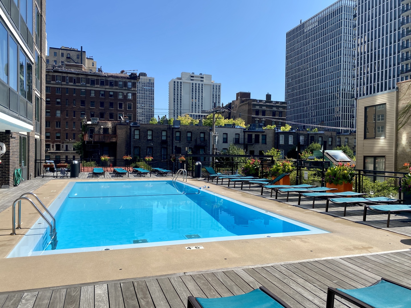 21 West Goethe Street, Unit 2A Chicago, IL 60610 - Photo 45 of 49 a view of a swimming pool with outdoor seating and city view