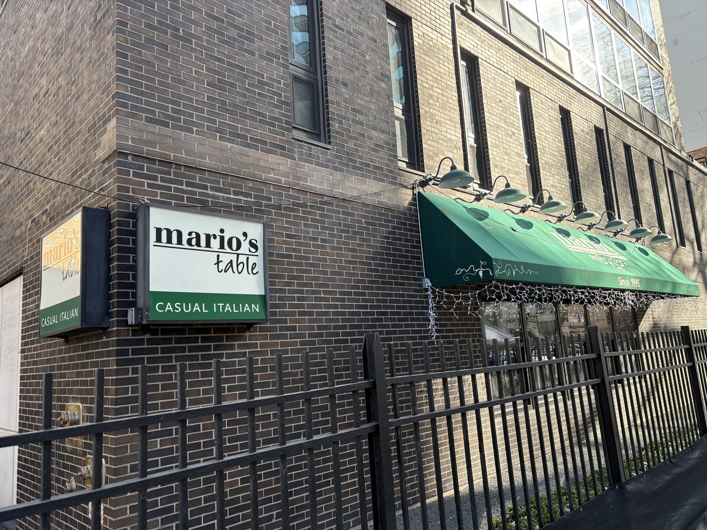 21 West Goethe Street, Unit 2A Chicago, IL 60610 - Photo 48 of 49 a sign on the side of a building