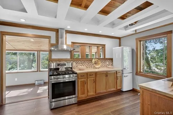a kitchen with a stove and a refrigerator