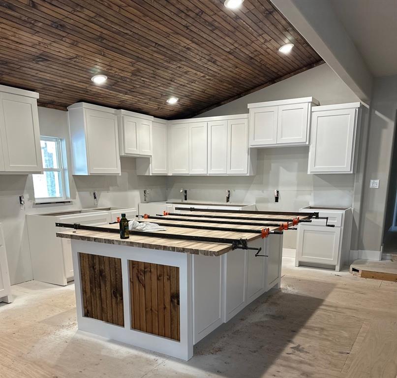 501 Rose Street Merkel, TX 79536 - Photo 5 of 13 a kitchen with stainless steel appliances granite countertop a stove sink and cabinets