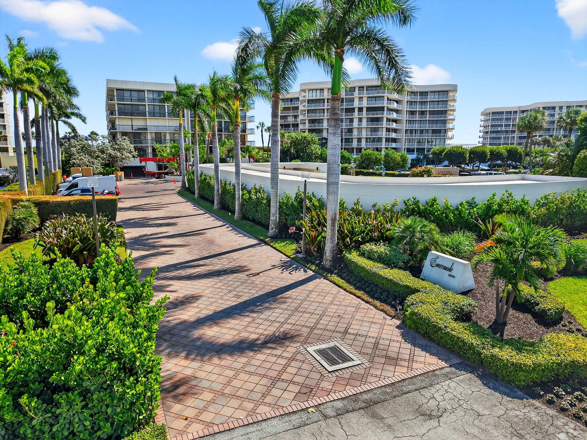 3390 South Ocean Boulevard, Unit 305 Palm Beach, FL 33480 - Photo 34 of 48 a view of a yard and front view of a building