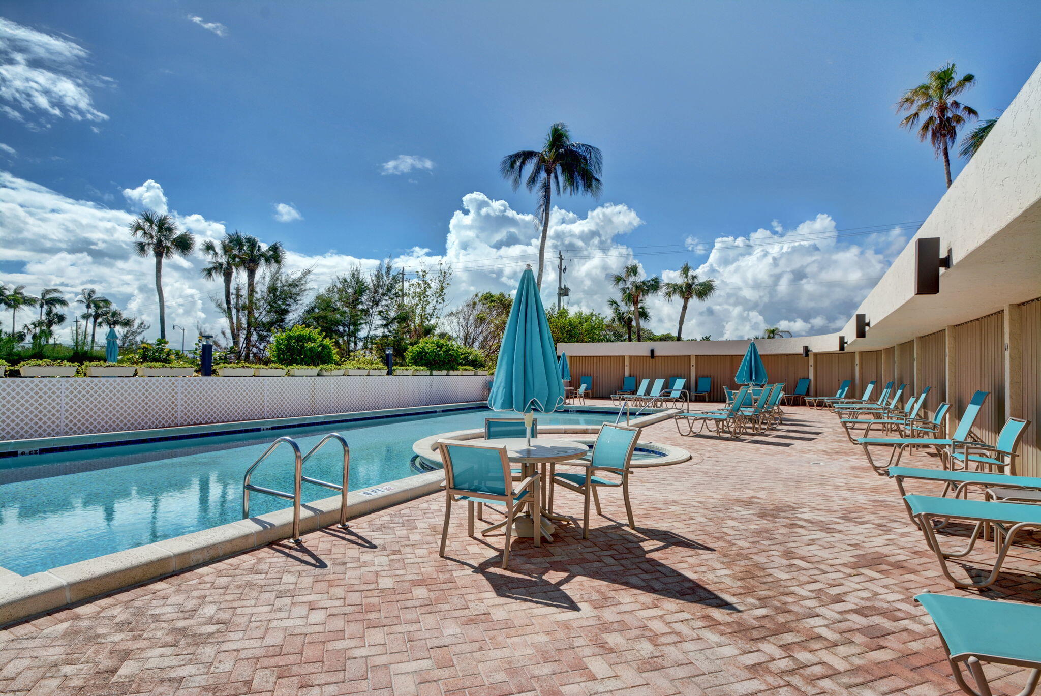 3390 South Ocean Boulevard, Unit 305 Palm Beach, FL 33480 - Photo 39 of 48 a view of a patio with a table and chairs