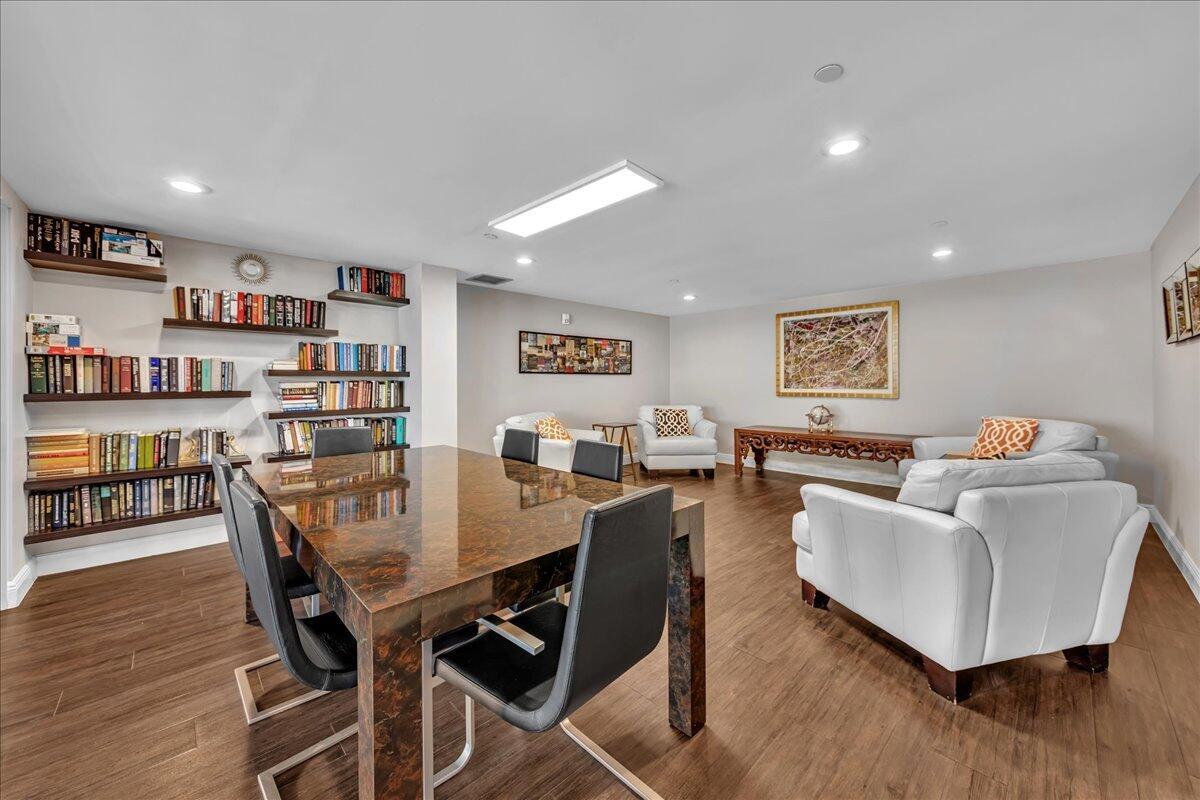 3390 South Ocean Boulevard, Unit 305 Palm Beach, FL 33480 - Photo 48 of 48 a living room with furniture and a wooden floor